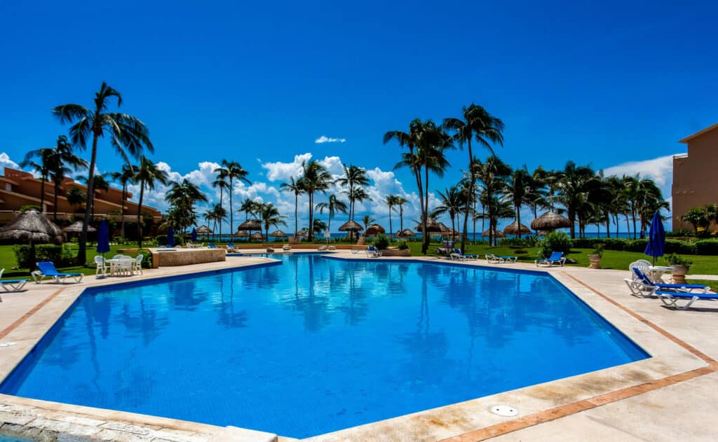 Villas del Mar Pool Area with Sea in Background
